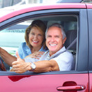 couple in a red car